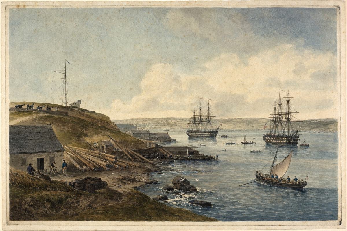 Hand-colored aquatint with watercolor wash, early 1810s, British marine print workshop; vantage from the slope above Halifax Dockyard looking southeast across the harbor, two Royal Navy ships riding at anchor with boats ferrying crew, a low shore battery to the left, signal mast on a headland, dockyard sheds with stacked spars and tar barrels; crisp plate mark, laid paper texture with light foxing, slight ink mottling in the sky; asymmetric composition with a small yawl pulling across the foreground; incidental detail of gulls and wet rocks at the shore; no title cartouche or labels.