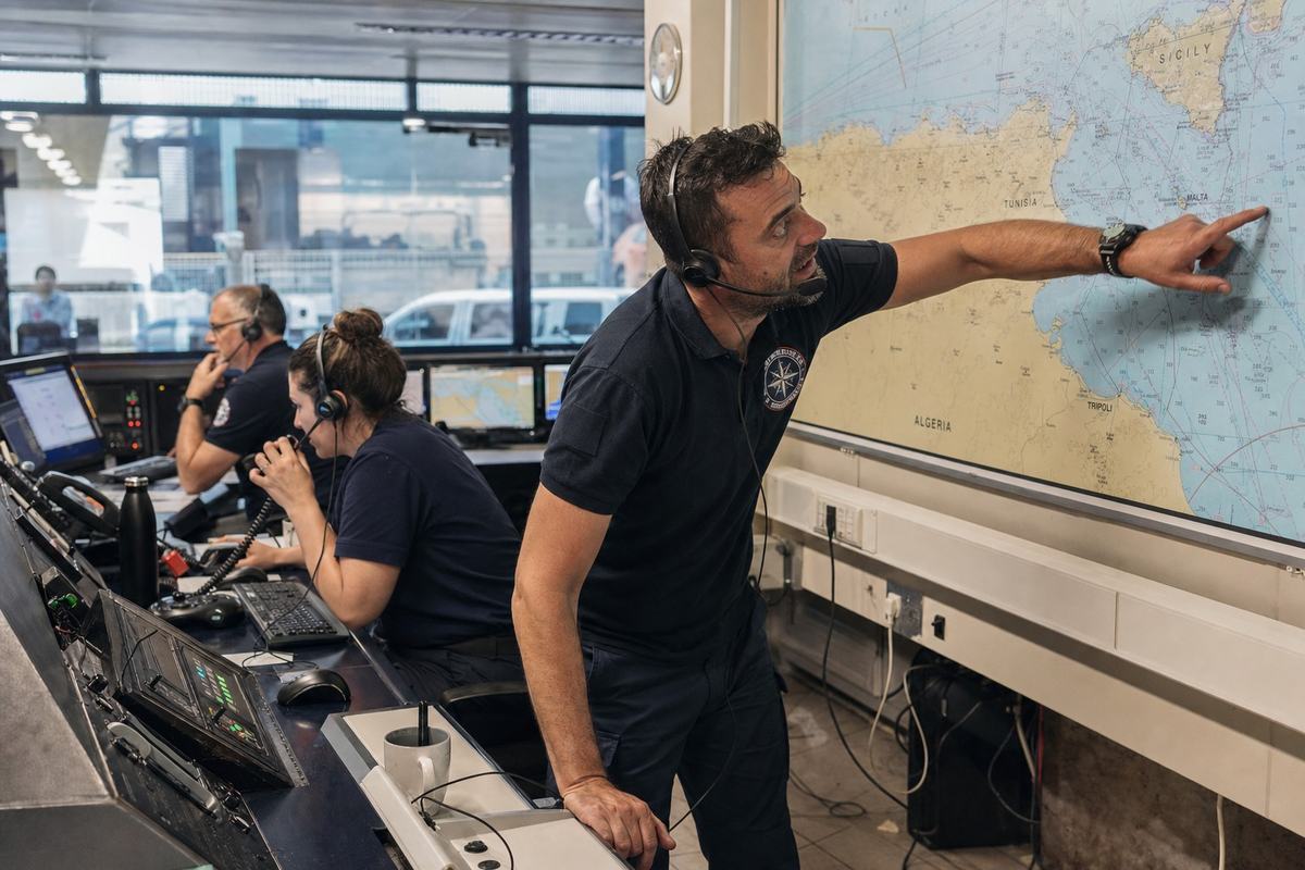 Inside the VRCC: duty officers watch the central Mediterranean plot and coordinate live cases from Valletta.